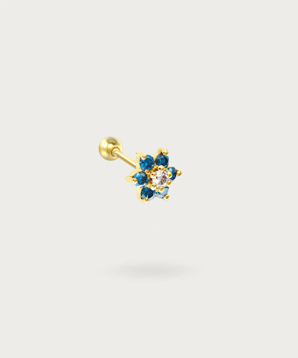 "Tragus Flower and Zircons Piercing on white background"