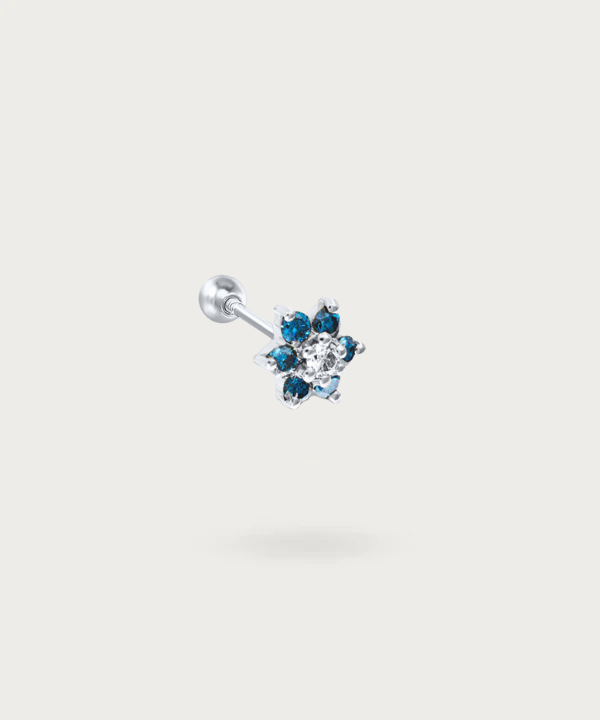 "Tragus Flower and Zircons Piercing in silver on white background"