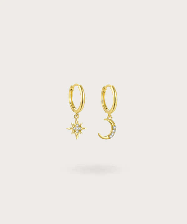 Esther's Sun and Moon hoop earrings shine brilliantly, portraying the celestial harmony of day and night.