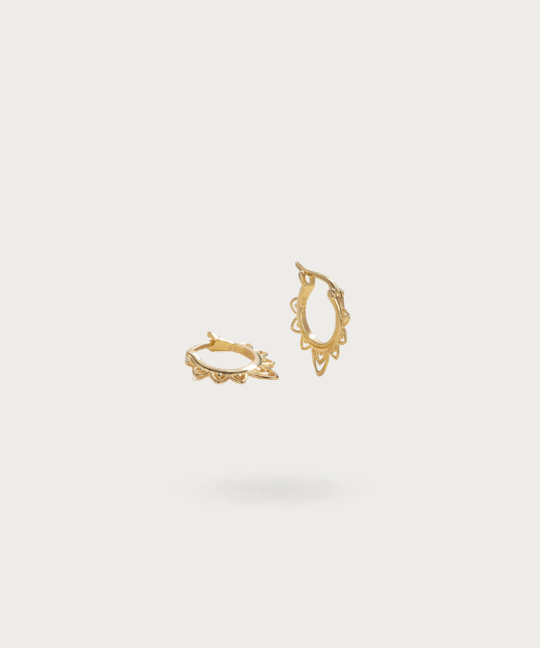 Rustic elegance of Amaya's Bohemian silver hoops.