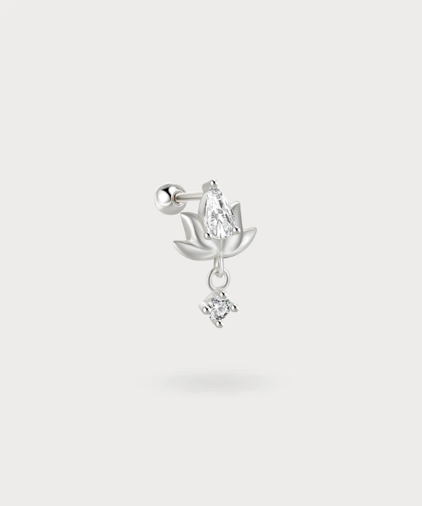 The grace of a lotus and the brilliance of a zircon merge in the Miriam piercing.