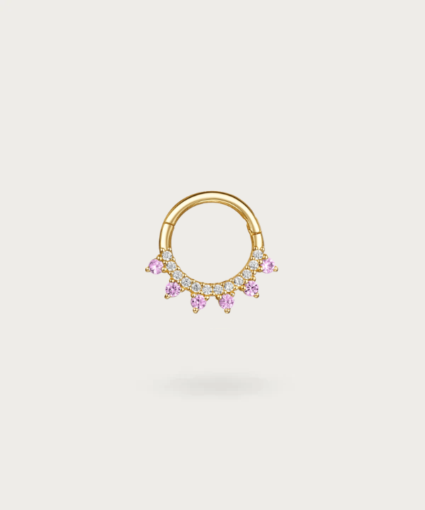 Gold hoop Earlobe piercing with embedded purple diamonds