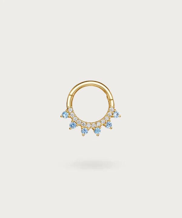 Gold hoop Earlobe piercing with embedded diamonds