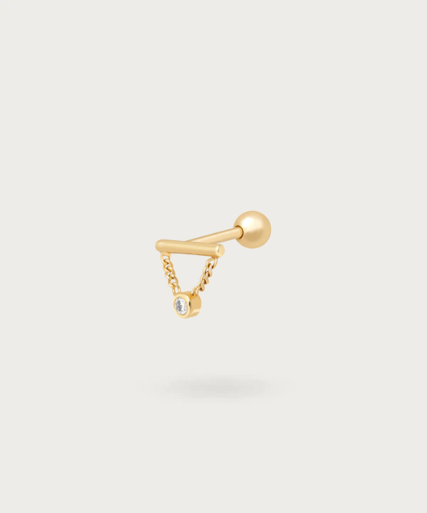 Helix Pendant Piercing with a golden finish.