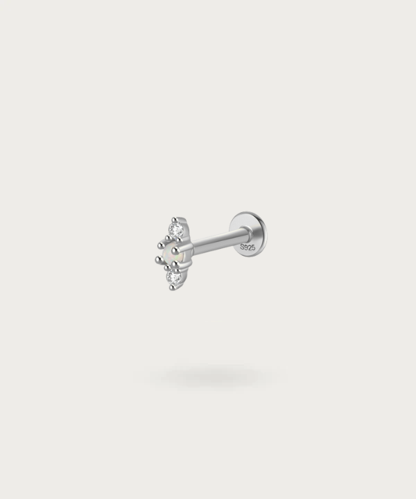 silver ear Earlobe piercing with precious stones