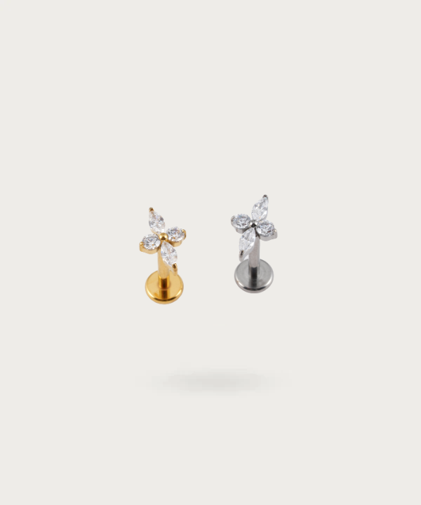 The Forward Helix Flower Piercing worn, illustrating its natural and poetic appeal.