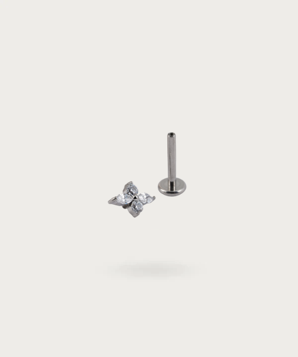 Front view of the Forward Helix Flower Piercing, emphasizing its delicacy.