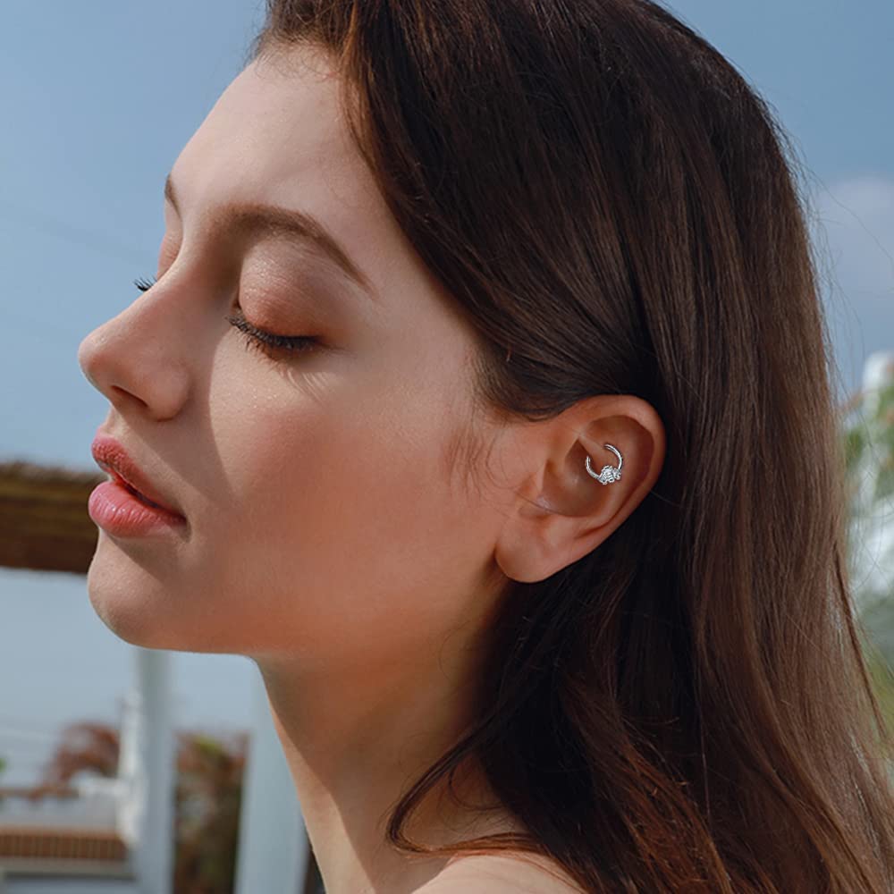 Titanium silver bee hoop piercing worn by a woman