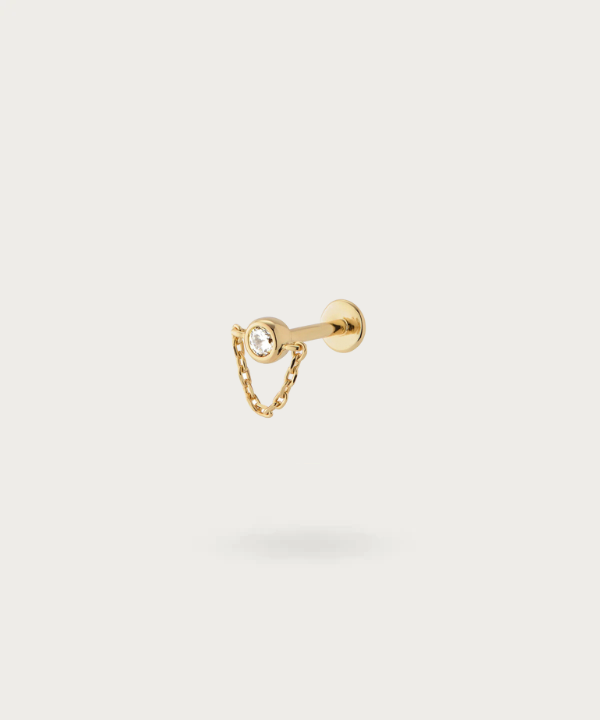 "Helix Piercing with Hanging Chain gold attractively on a white background"