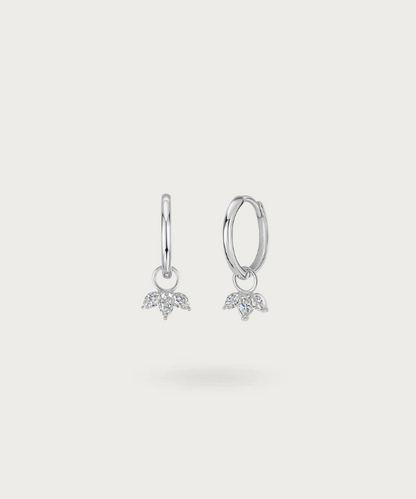 Experience a rain of glitter with Gisele's hoops, featuring delicate dangling zirconias.