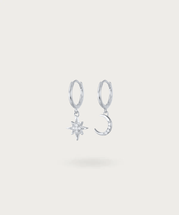 Dive into the cosmic dance of the sun and moon with Esther's sterling silver hoop earrings adorned with zirconia pendants.