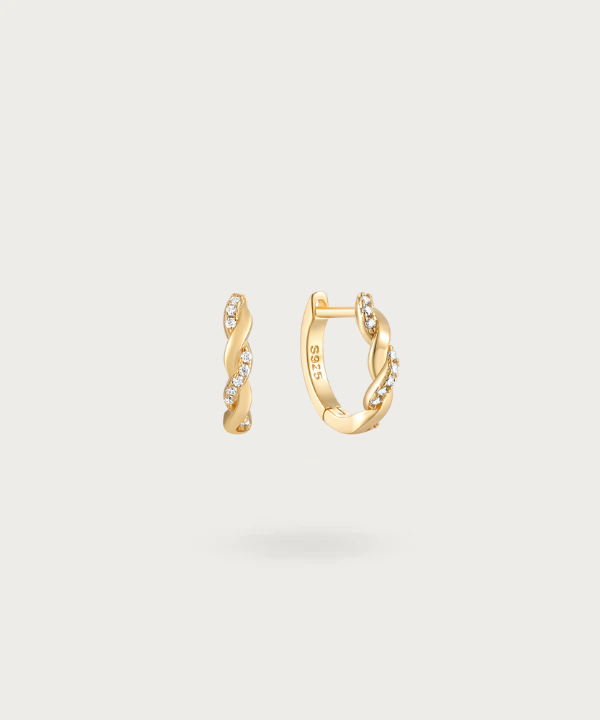 Contemporary twisted hoop earrings by Liliana with embedded zirconia.