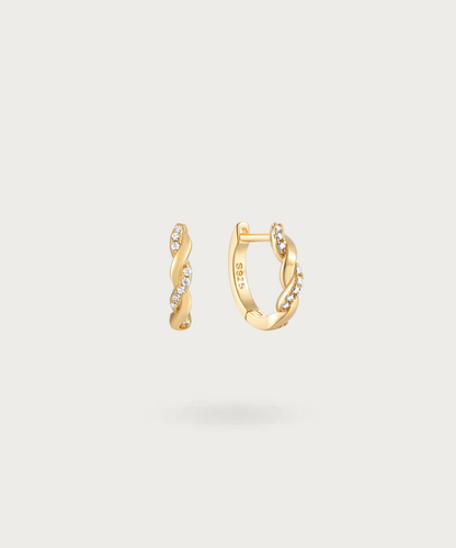 Contemporary twisted hoop earrings by Liliana with embedded zirconia.
