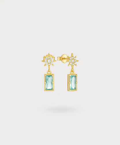 "Anatola long earrings with zircons, inviting a journey between sun and sea."