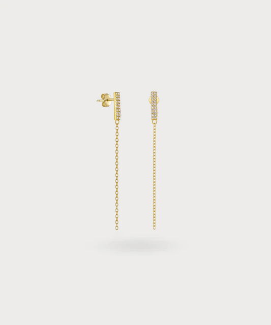 "Gina's long gold zirconia earrings: A blend of understated luxury and timeless elegance."
