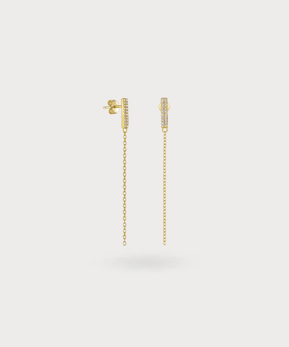"Gina's long gold zirconia earrings: A blend of understated luxury and timeless elegance."