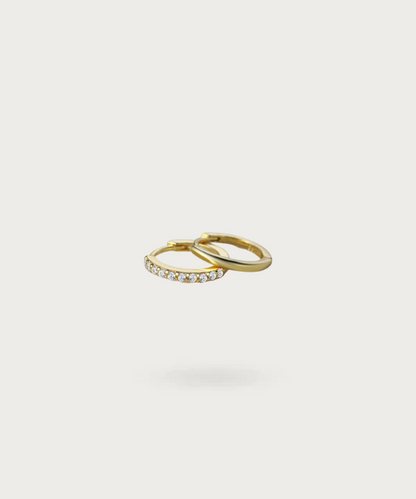 Sienna's shining duo: plain hoop and zirconia-adorned ring.