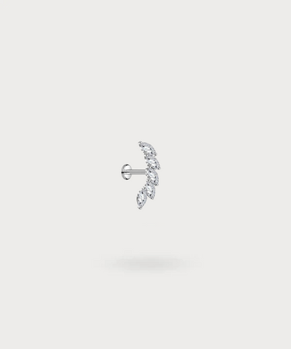 "Rita, a forward helix piercing that combines modernity and elegance."