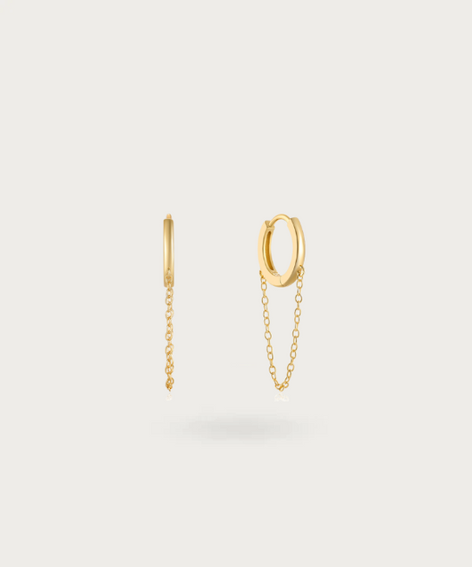Lusiana's silver hoop earrings featuring an elegant hanging chain.