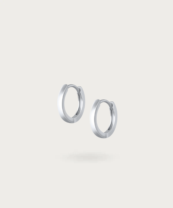 Garci's classic hoop earrings showcasing simple elegance.