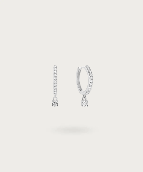 Sparkle with every movement: Sol's hoops adorned with zirconias and a swaying pendant.