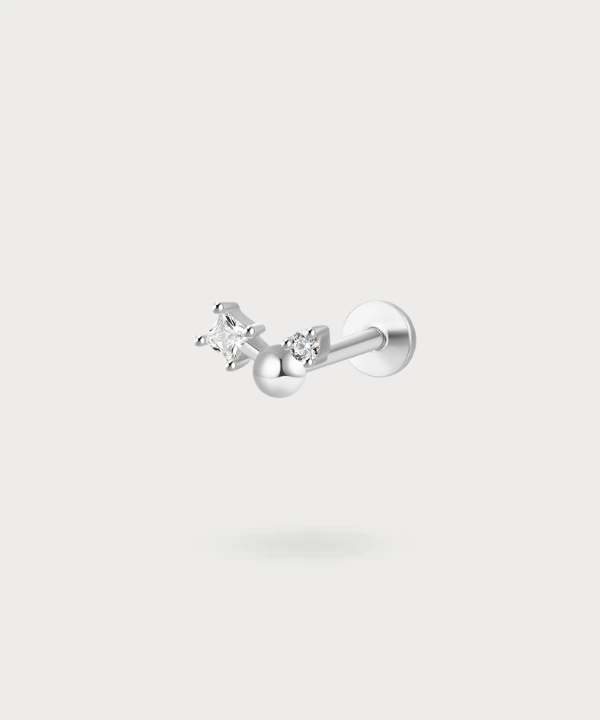 Subtle glow for your tragus: Yolanda, in titanium and zircons.