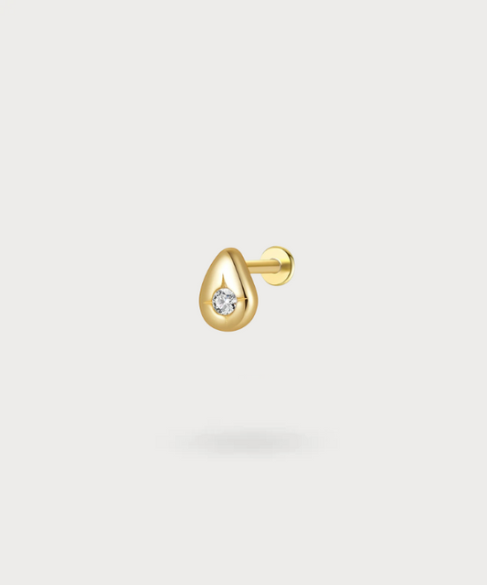 Montse, a helix piece in gold or silver resembling a glistening water drop