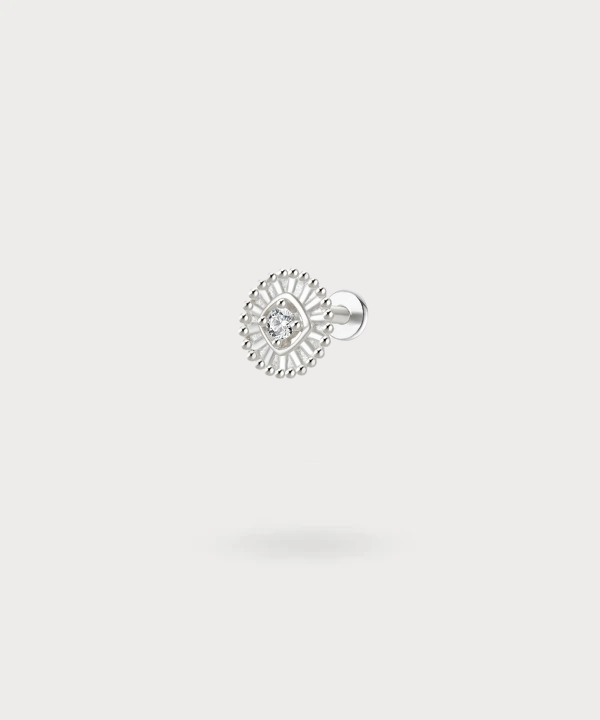 The Sabrina lobe piercing evokes a golden or silver sun around your ear