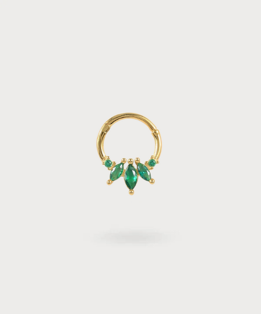 Arrate gold piercing with green stones evoking emeralds
