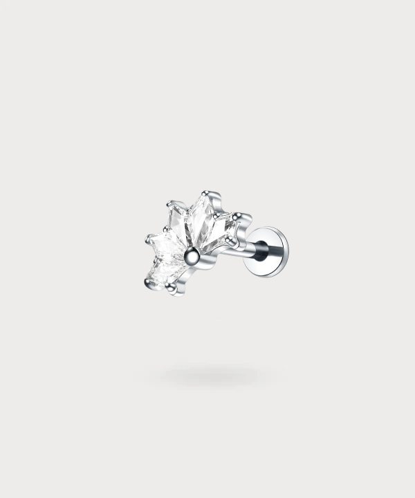 Candela, a tragus stud that merges nature and nobility with a titanium lotus flower.