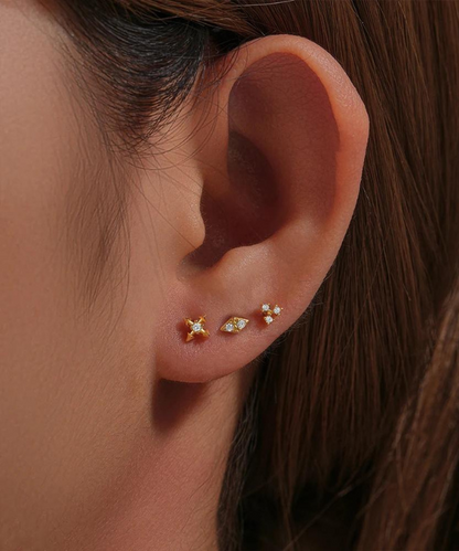 Golden Elegance of the Adrianna Forward Helix Piercing, a touch of sparkling nature.