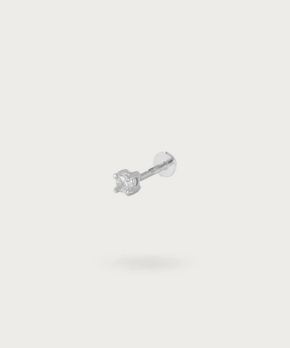 Flat Stud Piercing, an elegant addition to your jewelry collection.