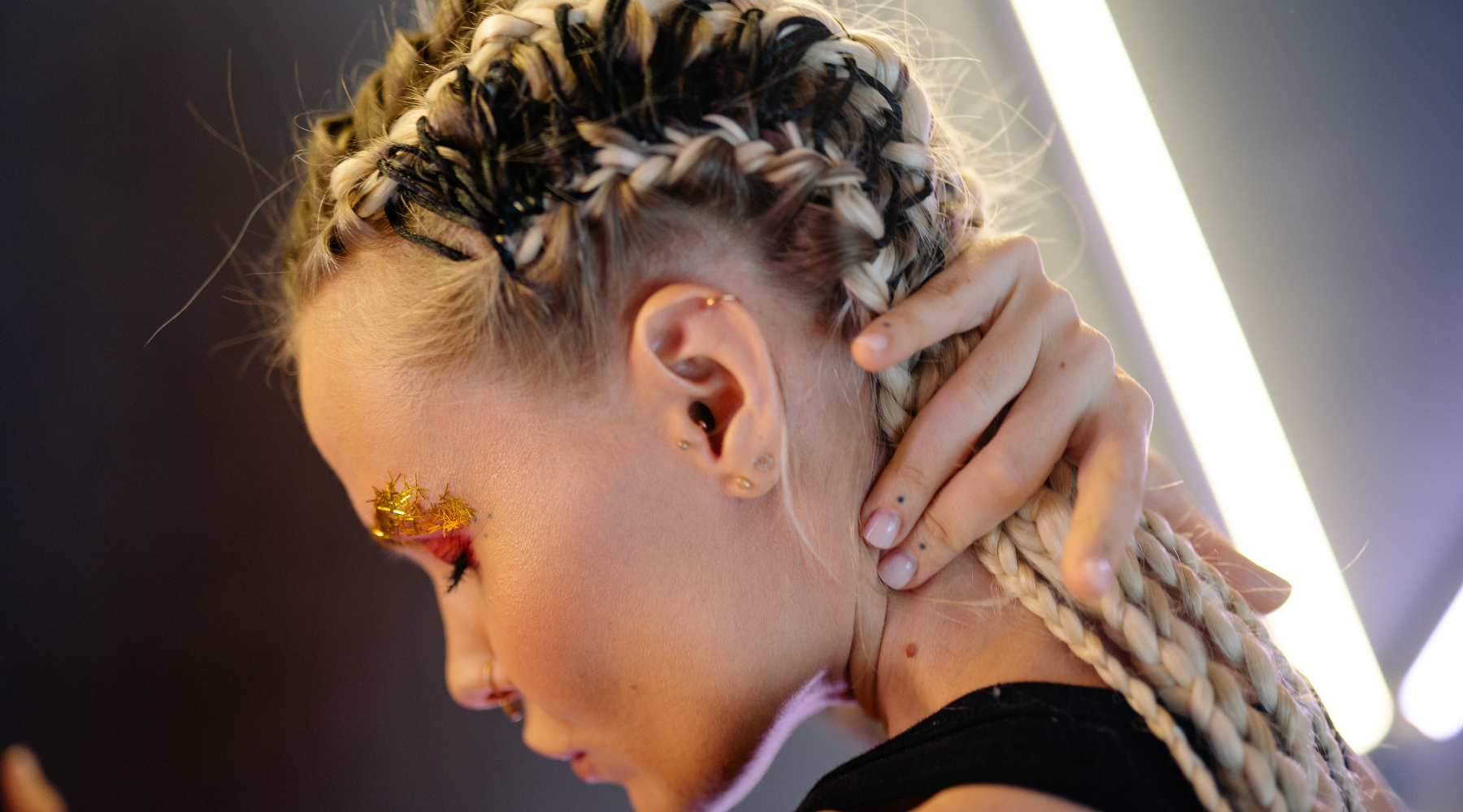 Women wearing jewels from Luna Piercings on her ears