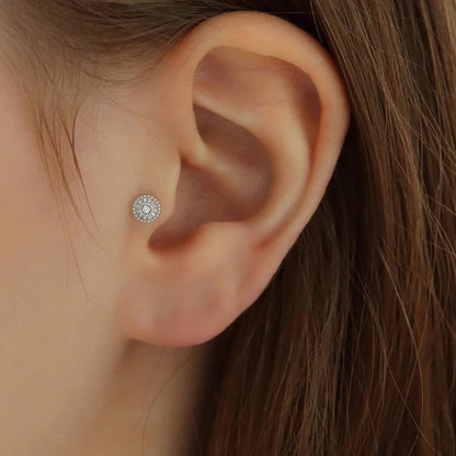 The timeless glow of the Sabrina lobe piercing with metal bead detailing