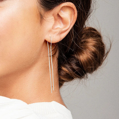 Dangle in style with Carina's long earrings, capturing light with every sway.