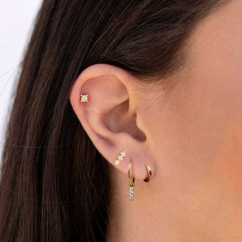 Seamless blend of versatility and elegance: Garci's silver hoop earrings.