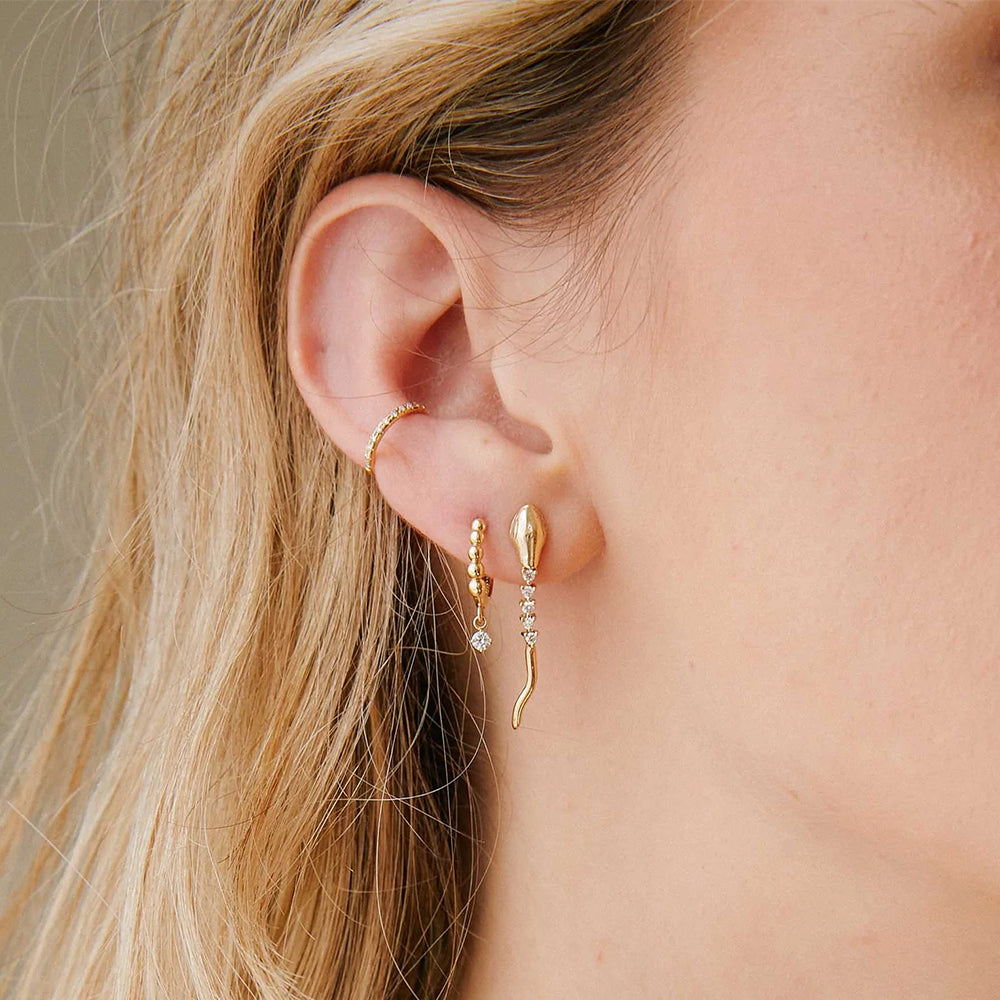 Embrace an exotic touch with Letizia's cobra earrings, a fusion of modern design and ancient allure.