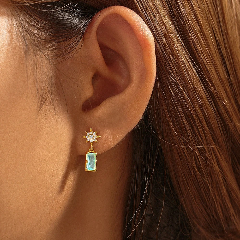 "Anatola earrings: where zircon meets the artistry of sun and sea inspiration."