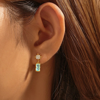 "Anatola earrings: where zircon meets the artistry of sun and sea inspiration."