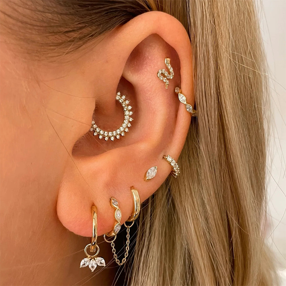 Elevate any ensemble with Gisele's sterling silver hoops and their shimmering zirconias.