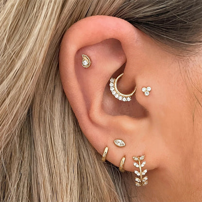 Ivana's unmatched pair of zirconia and gold-plated silver hoops
