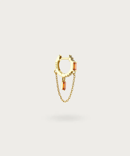 Zircon Chain Piercing in gold finish on a white background