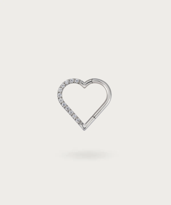Close-up view of the right silver Titanium Heart Clicker Daith Piercing