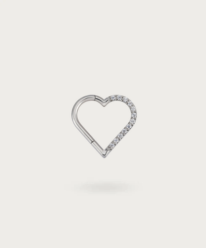 Close-up view of the left silver Titanium Heart Clicker Piercing