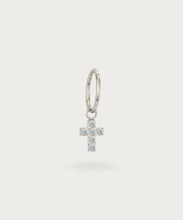 Close-up of the Ear Cross Piercing, highlighting its detailed cross design and shiny finish