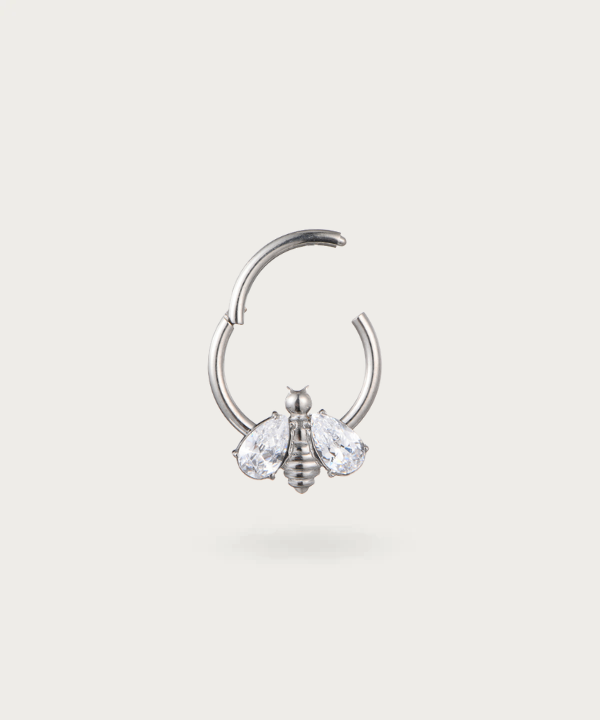 "Detail of the bee on the Bee Hoop Snug Piercing."