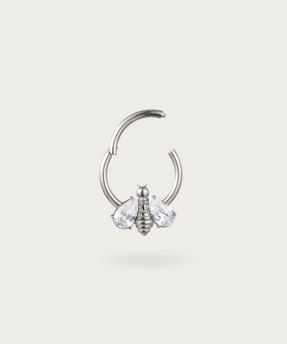 "Detail of the bee on the Bee Hoop Snug Piercing."