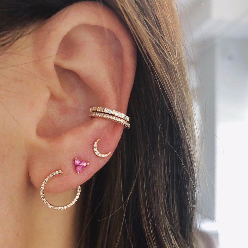 moon ear piercing worn by woman