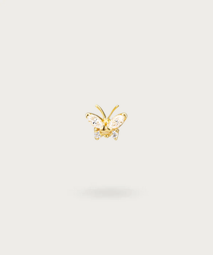 "Close-up view of the gold Butterfly Forward Helix Piercing."