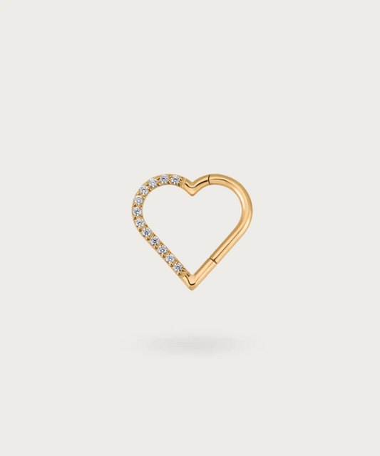 Close-up view of the right golden Helix Titanium Heart Clicker Piercing